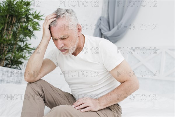 Elder man with headache
