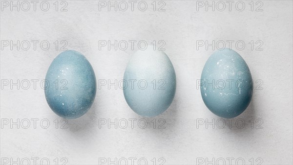 Flat lay three easter eggs