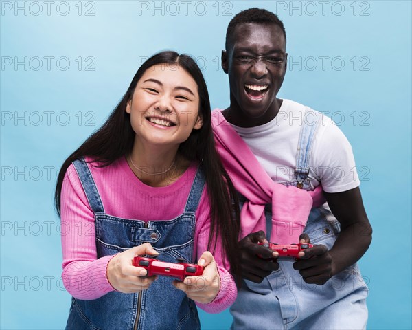 Happy couple playing videogames