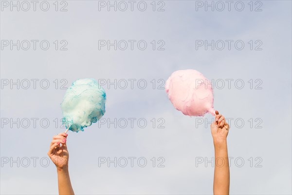 Hands holding cotton candy