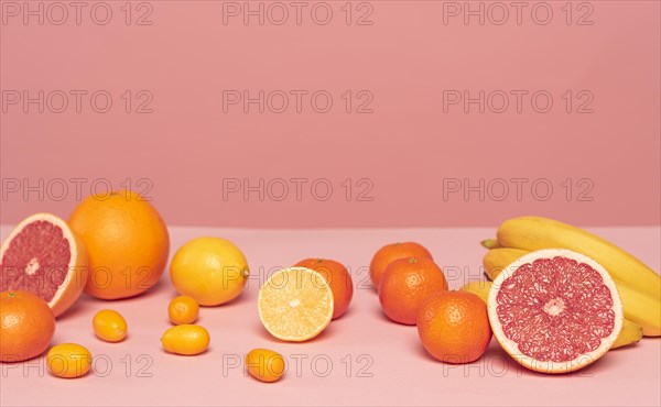 Assortment citruses pink table