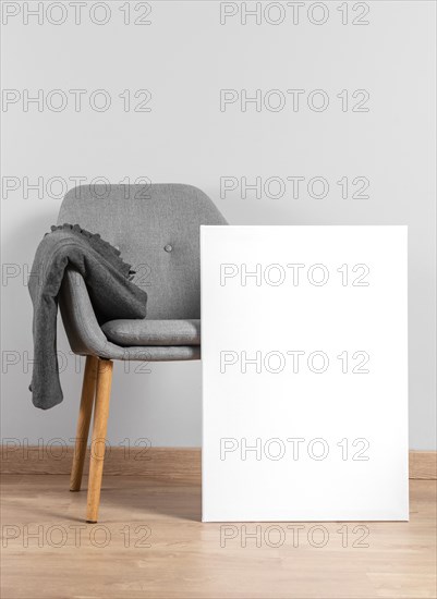 Frame mock up beside chair