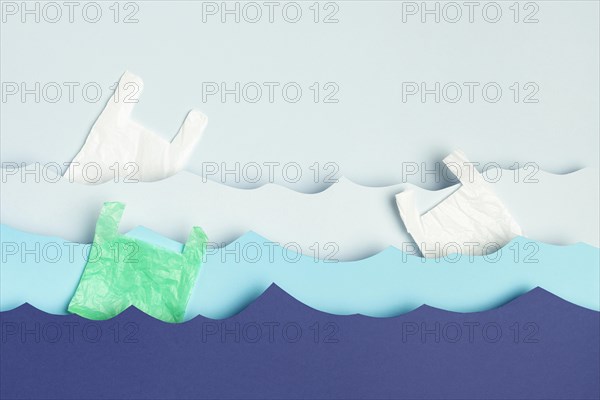 Top view paper ocean waves plastic bags