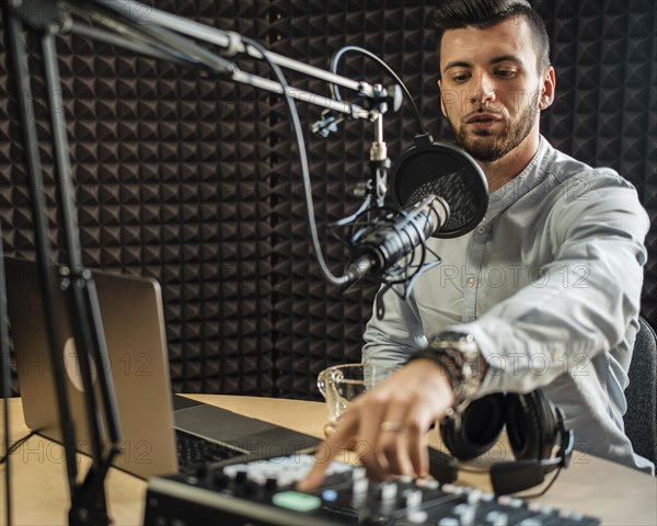 Medium shot young man working radio