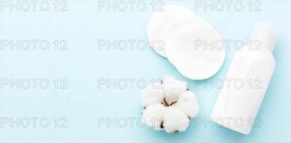 Top view cosmetic cream with cotton pads