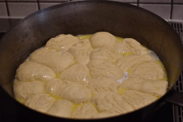 Preparation of steam noodles in rustic old steam noodle pan