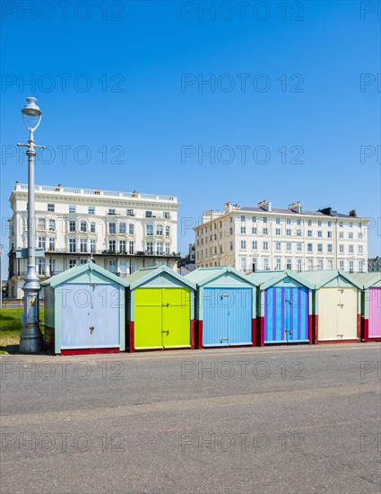 Row of beautiful colourful seaside bathing cottages in Brighton and Hove