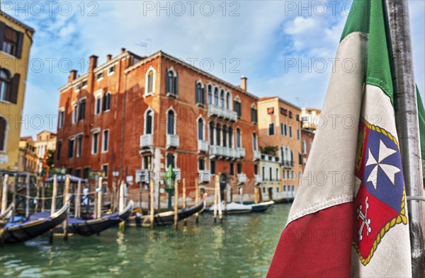 Italian maritime flag and Venetian Renaissance waterfront palaces