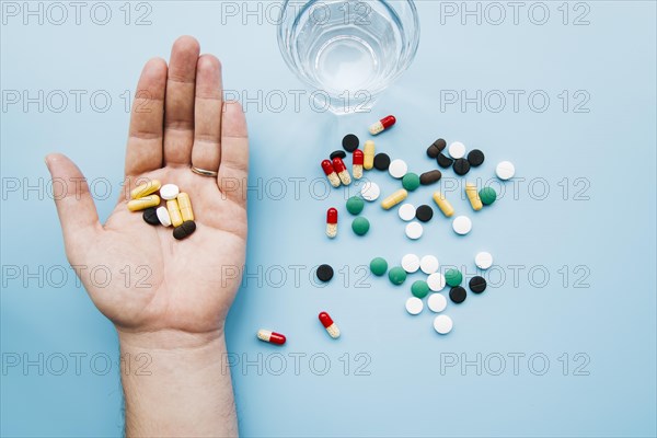 Top view hand holding pills