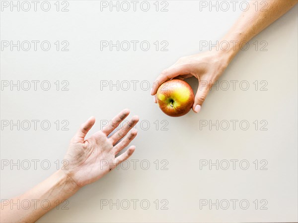 Top view hands exchanging food