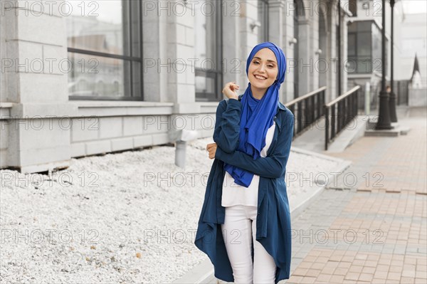 Beautiful girl with hijab smiling outdoors