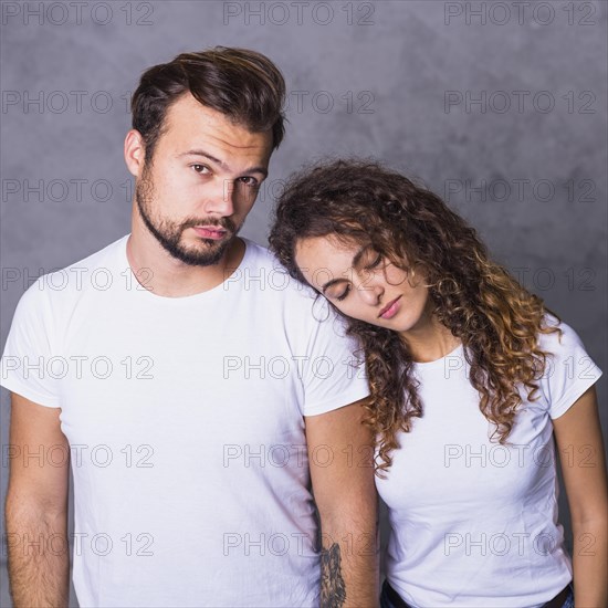 Woman holding head man shoulder