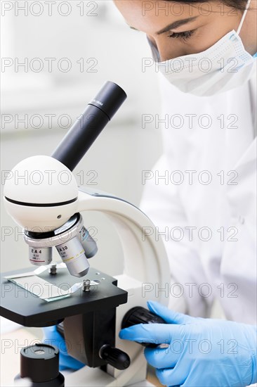 Woman with mask microscope