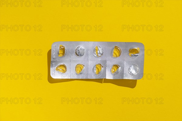 Empty tablet blister pack against a monochrome background