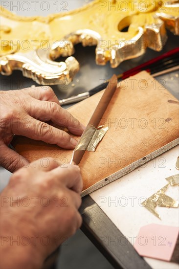 Cutting gold leaf