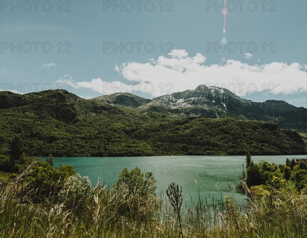 Landscape lake surrounded by mountains