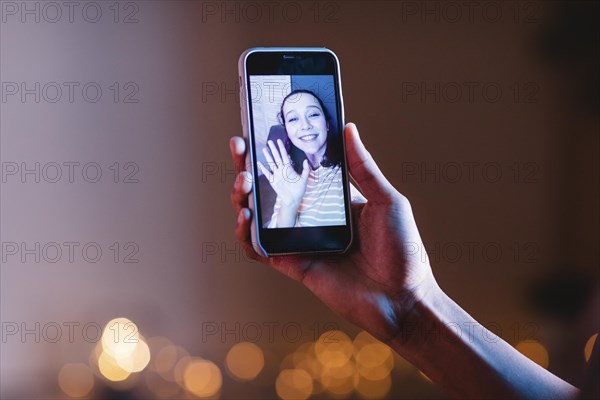 Man video calling woman using smartphone