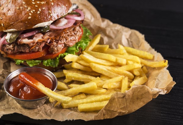 Classic take away burger with fries ketchup