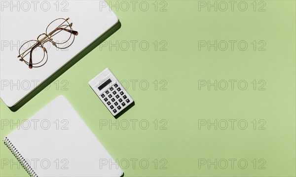 Top view desk minimal glasses calculator