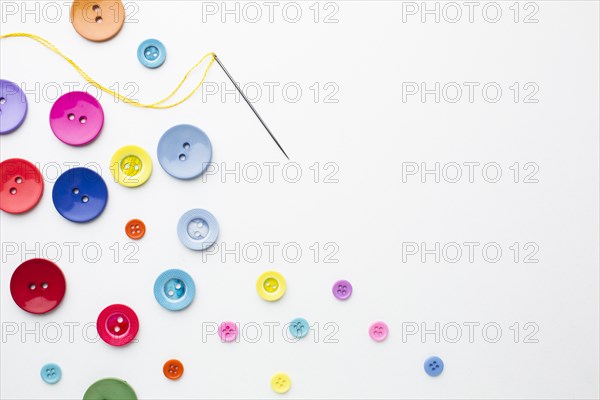 Clothes colourful buttons with needle