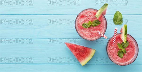 Top view two glasses with straws watermelon cocktails