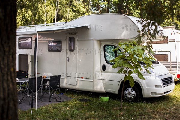 White van with table chairs it