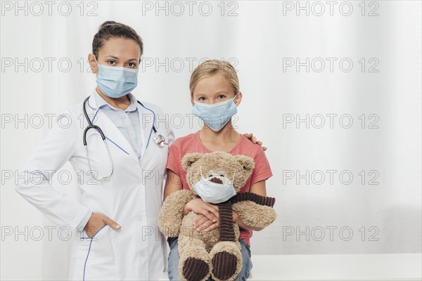 Medium shot doctor kid bear