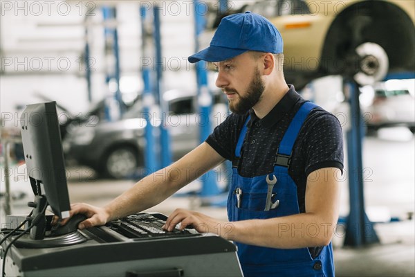 Repairmen using computer workshop