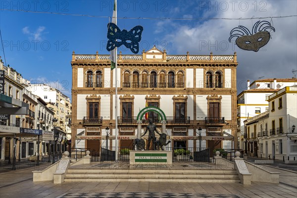 Statue of Hercules with two lions in the Plaza del Socorro square