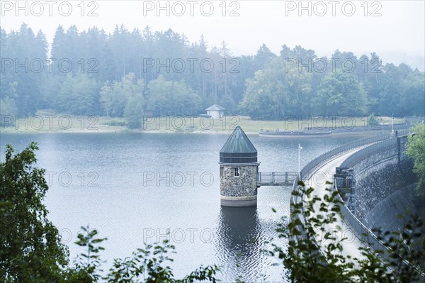 Dam wall of the Dreilaegerbach dam near Roetgen in the fog