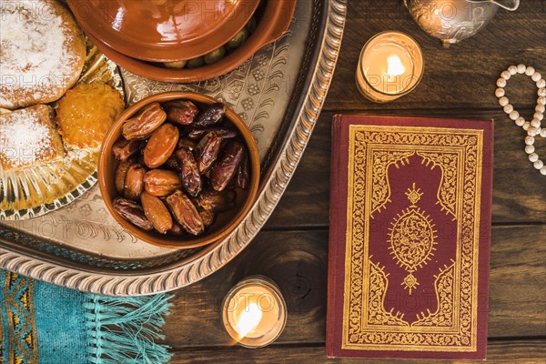 Quran candles near arabic food