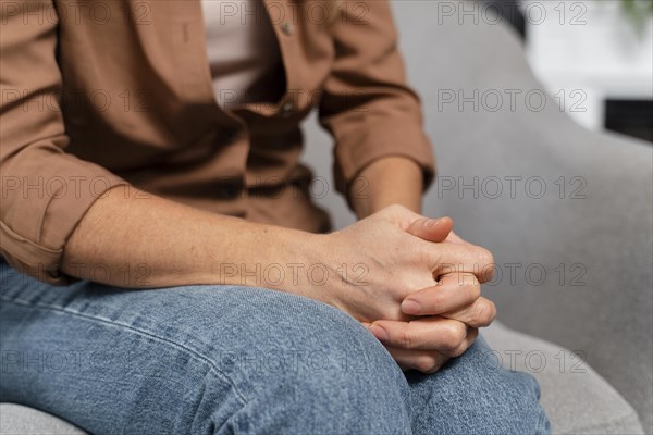 Woman holding hands together