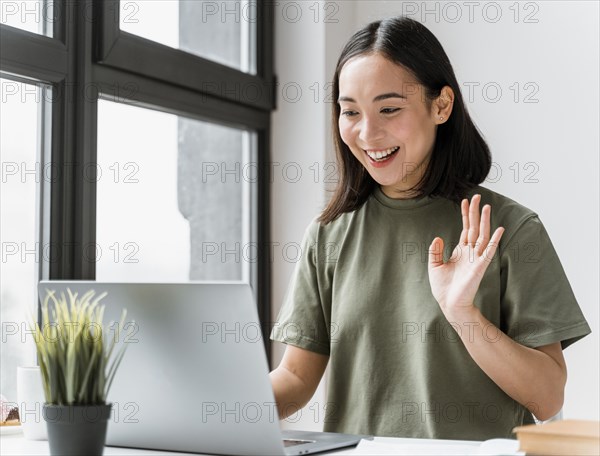 Woman having video call laptop