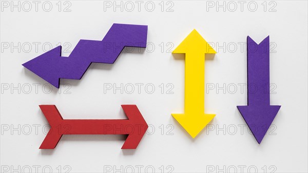 Flat lay colorful set arrows white background