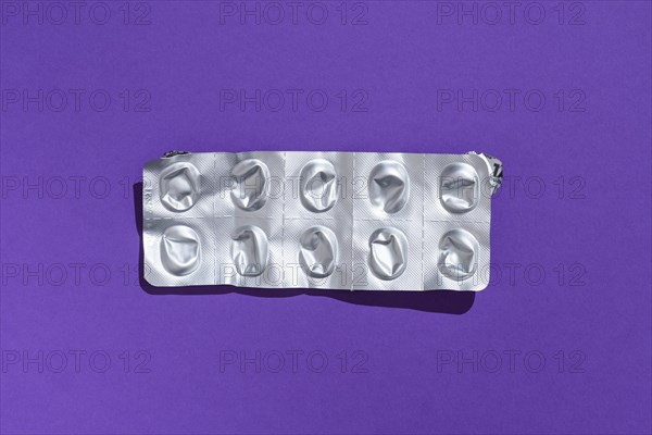 Empty tablet blister pack against a monochrome background