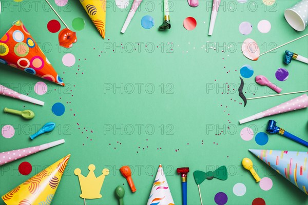 Colorful birthday frame multicolor party items green background