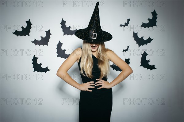 Smiling woman with witch hat