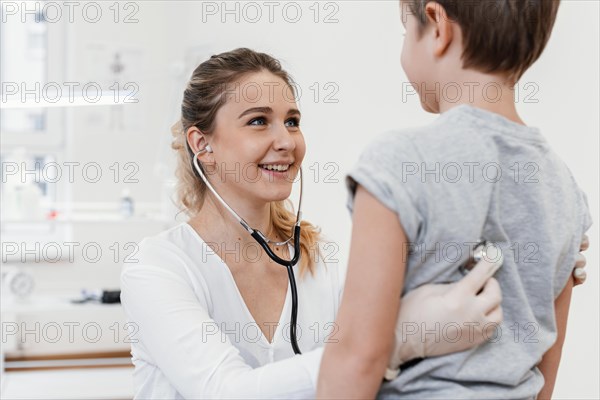 Close up pediatrician checking kid