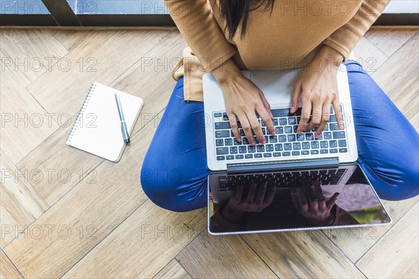 Woman typing laptop