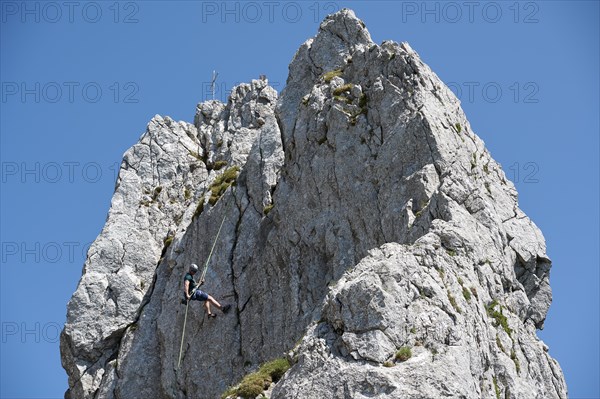 Climber abseiling on the Rossstein Needle