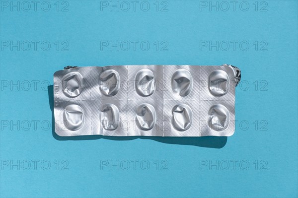 Empty tablet blister pack against a monochrome background