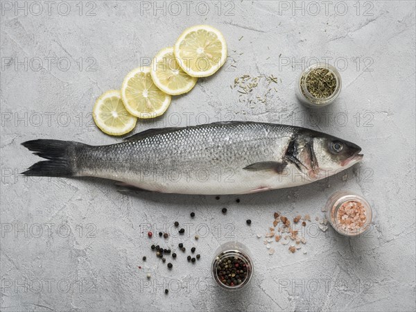 Flat lay fish lemon spices