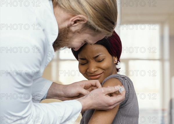 Close up woman getting vaccinated