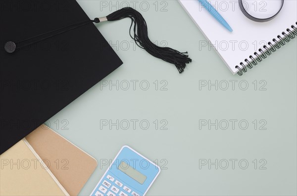 Flat lay festive graduation composition with academic cap