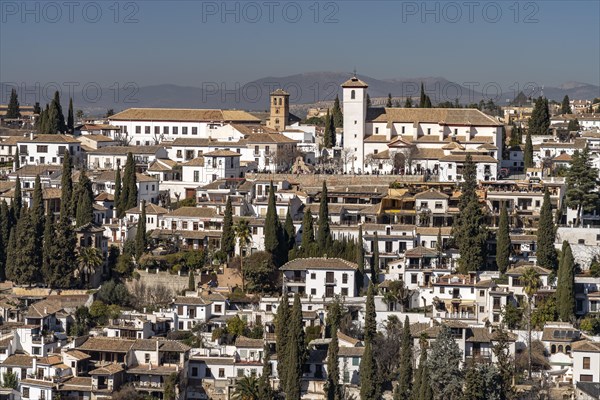 The former Moorish residential district of Albaicin with the Mirador de San Nicolas and the church of San Nicolas in Granada