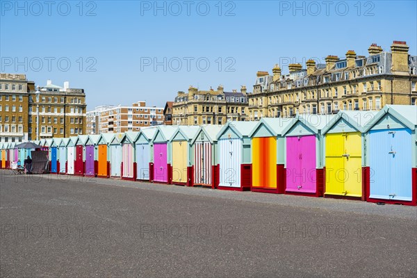 Row of beautiful colourful seaside bathing cottages in Brighton and Hove