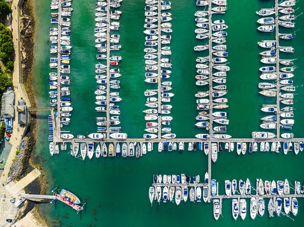 Top Down view over Boats and Yachts in Brixham Marina from a drone