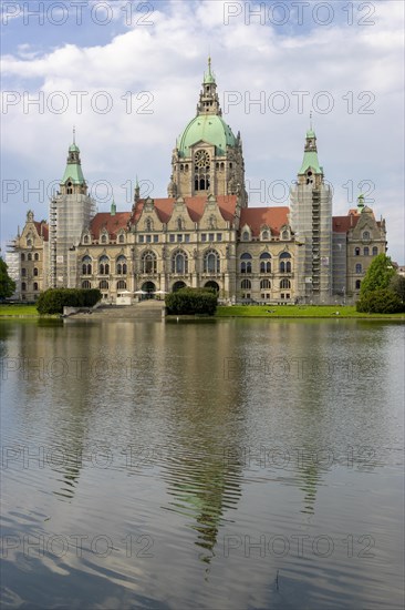 New Town Hall with reflection in the water at the Maschteich in the Maschpark