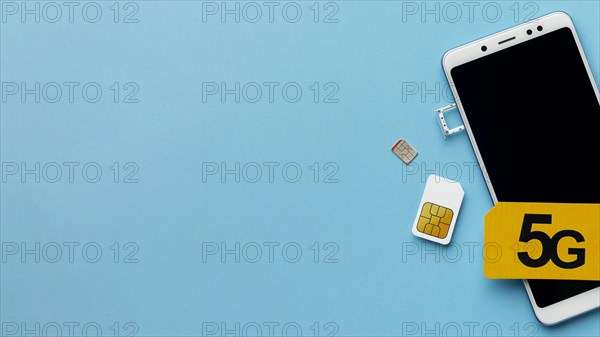 Top view smartphone with sim card copy space