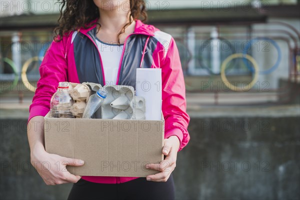 Woman holding recycle cardboard box